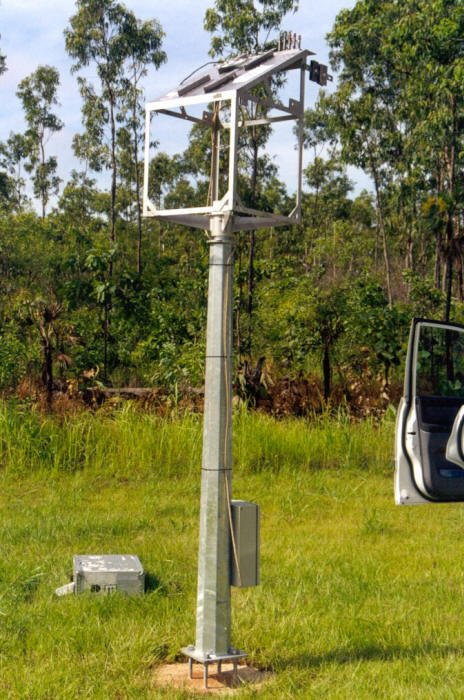Outdoor exposure test station with specimen rack on top and data logger attached below at an Army Base in Northern Australia. (Courtesy of DSTO Australia)