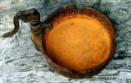 Corroded ashtray with a typical rust color 